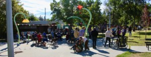 Crowd at the 2022 Highlands Community League Annual General Meeting, in the spray park at the Highlands Park